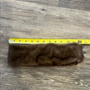 Brown Neiman Marcus mink headband with Velcro closure at back.